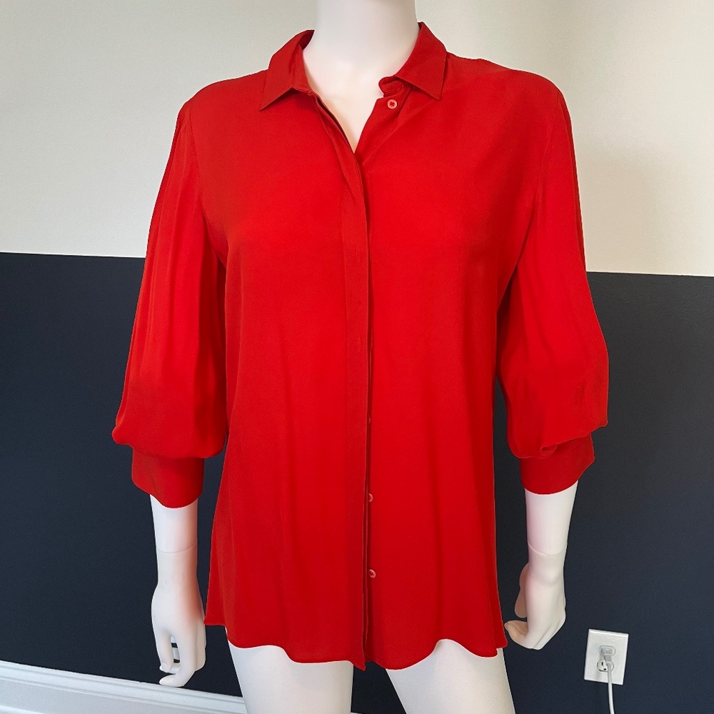 Red blouse with trim detail on cuff